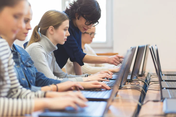 Teacher taking students doubt at Netmax Technologies in Full Stack Development Training